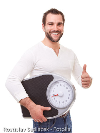 Man with scale weight makes gesture with thumb up