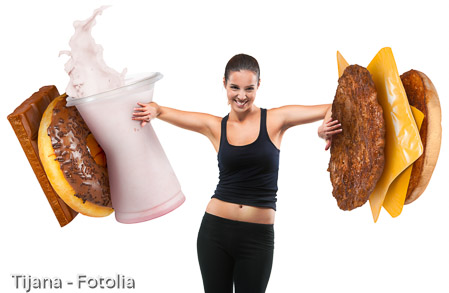 Fit young woman pushing fast food