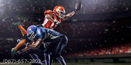 American football player in action at game time