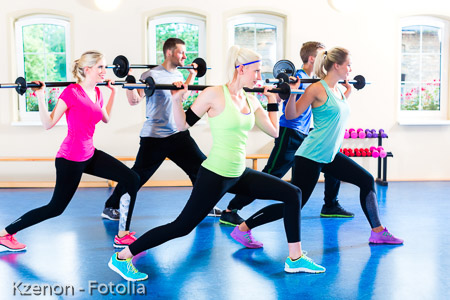 weight training in the gym with dumbbells