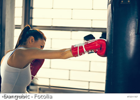 Female Boxer At Training