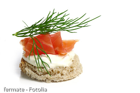 canape wiht salmon and  dill garnish,  isolated on white