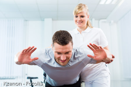 Physiotherapist or sport doctor with patient