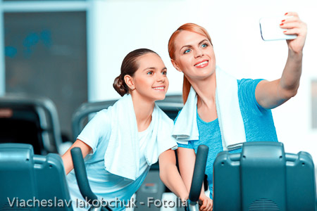 Cute teenage girl and her mom at sports club