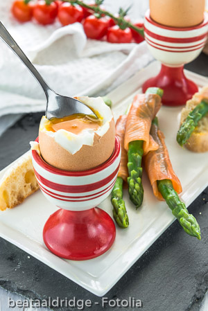 Breakfast with egg, green asparagus and smocked salmon