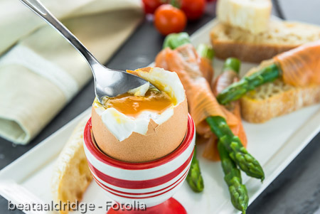 Breakfast with egg, green asparagus and smocked salmon