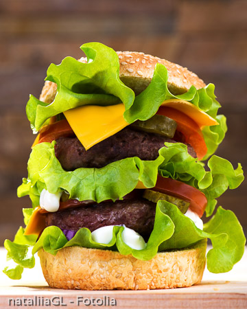 Big burger with beef cutlet and fresh vegetables