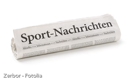 Zeitungsrolle mit der Überschrift Sport-Nachrichten