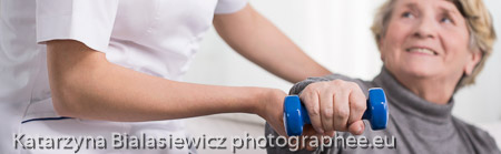 Elder woman training with dumbbell