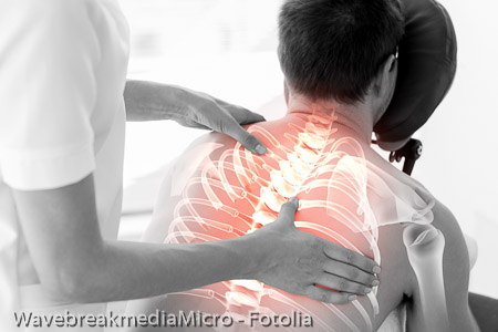 Highlighted spine of man at physiotherapy