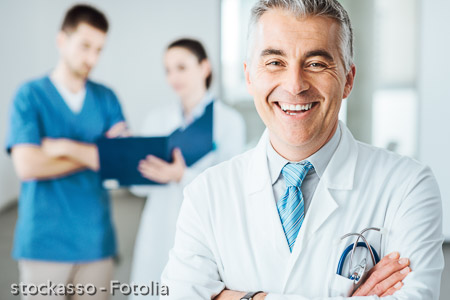 Confident doctor at hospital posing
