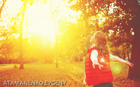 happy girl enjoying life and freedom in the autumn on nature