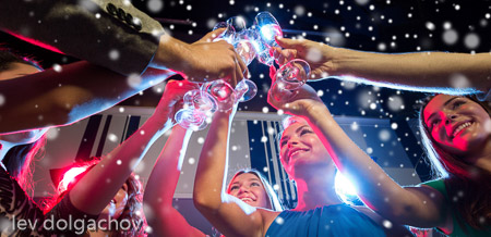 smiling friends with glasses of champagne in club