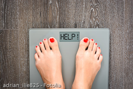Lose weight concept with person on a scale measuring kilograms
